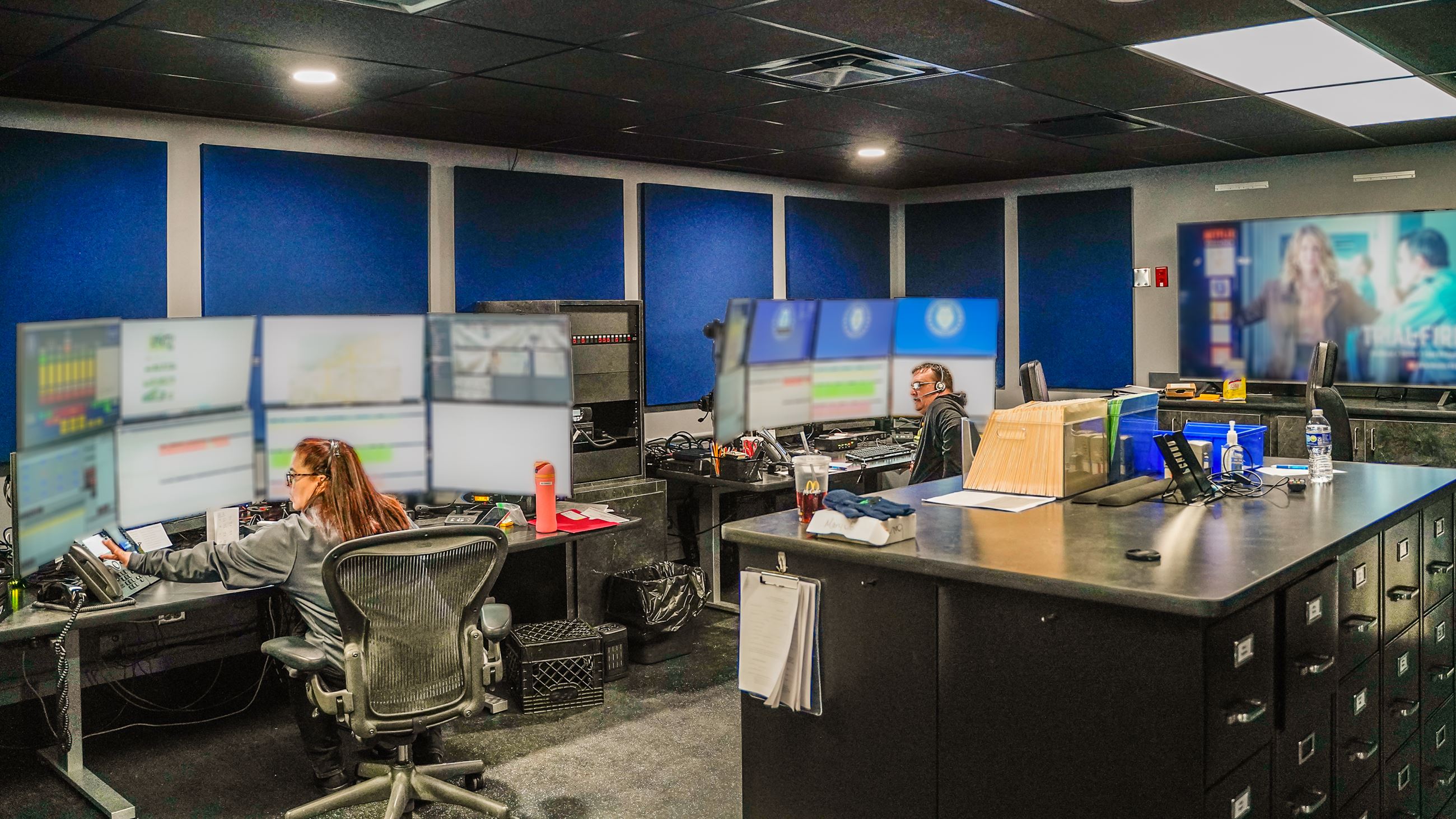 Dispatchers sitting in communications room.