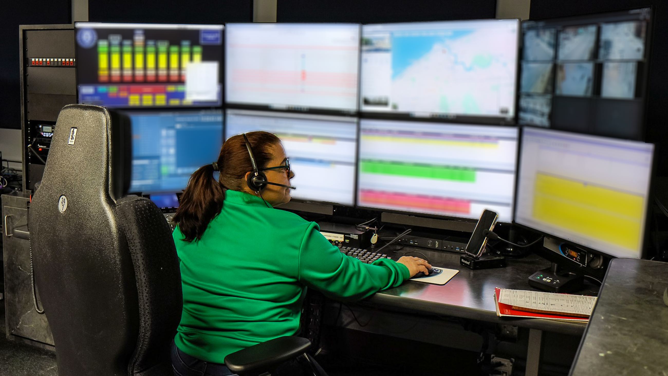 Dispatcher sitting in communications room.